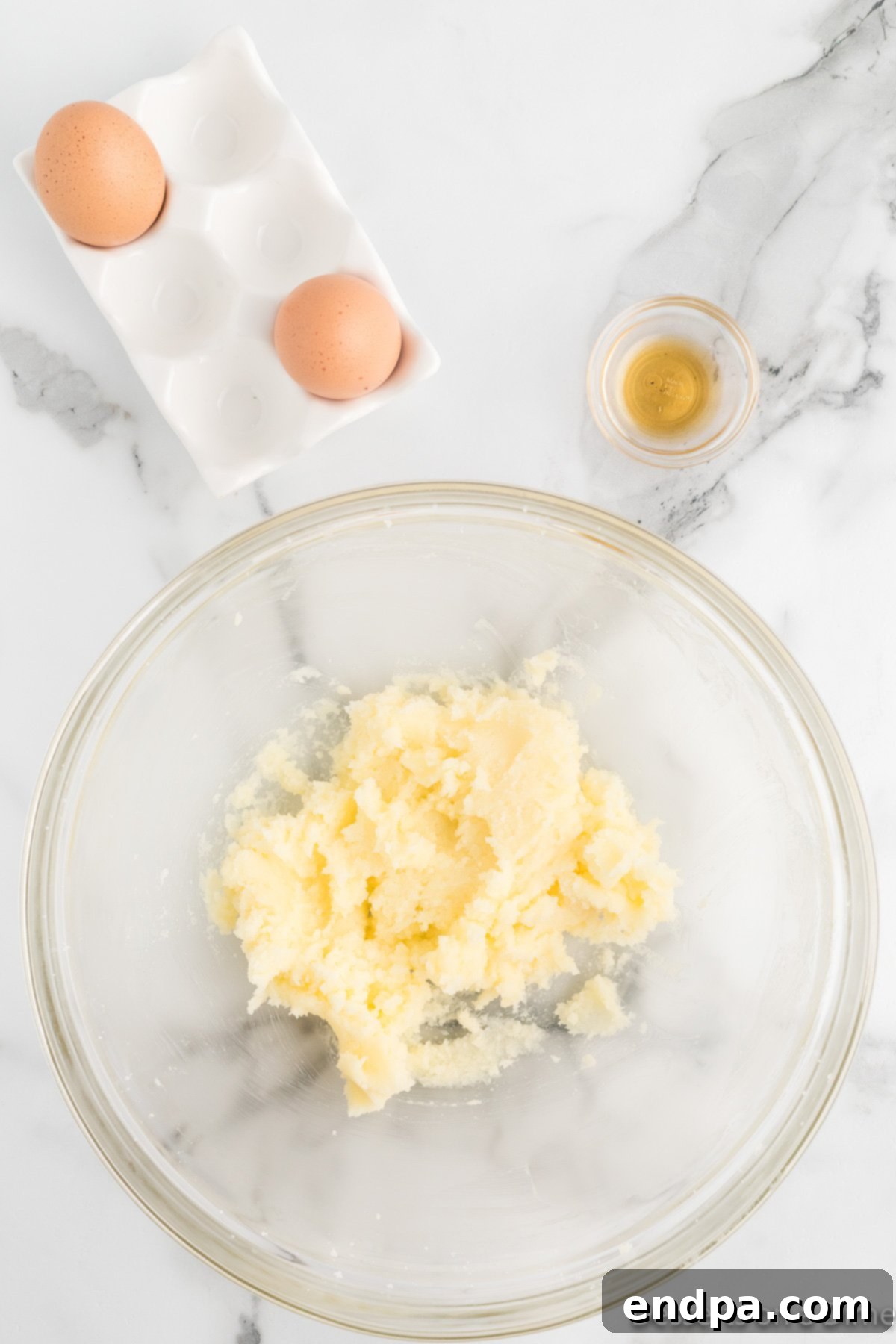 Grilled Pineapple Sweetbread 7 Sugar mixture in bowl with eggs and vanilla added.