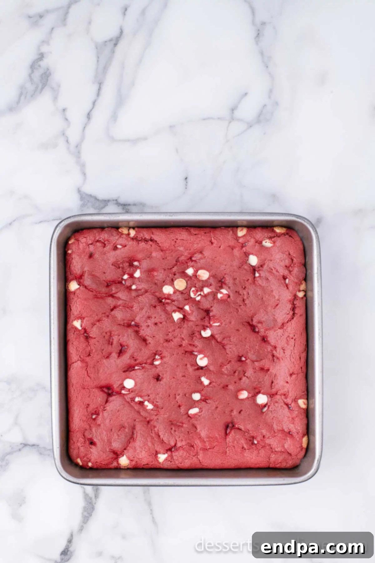 Ruby Red Brownie Bliss 7 Baked Red Velvet Brownies in a baking dish, with a slight crackled top.