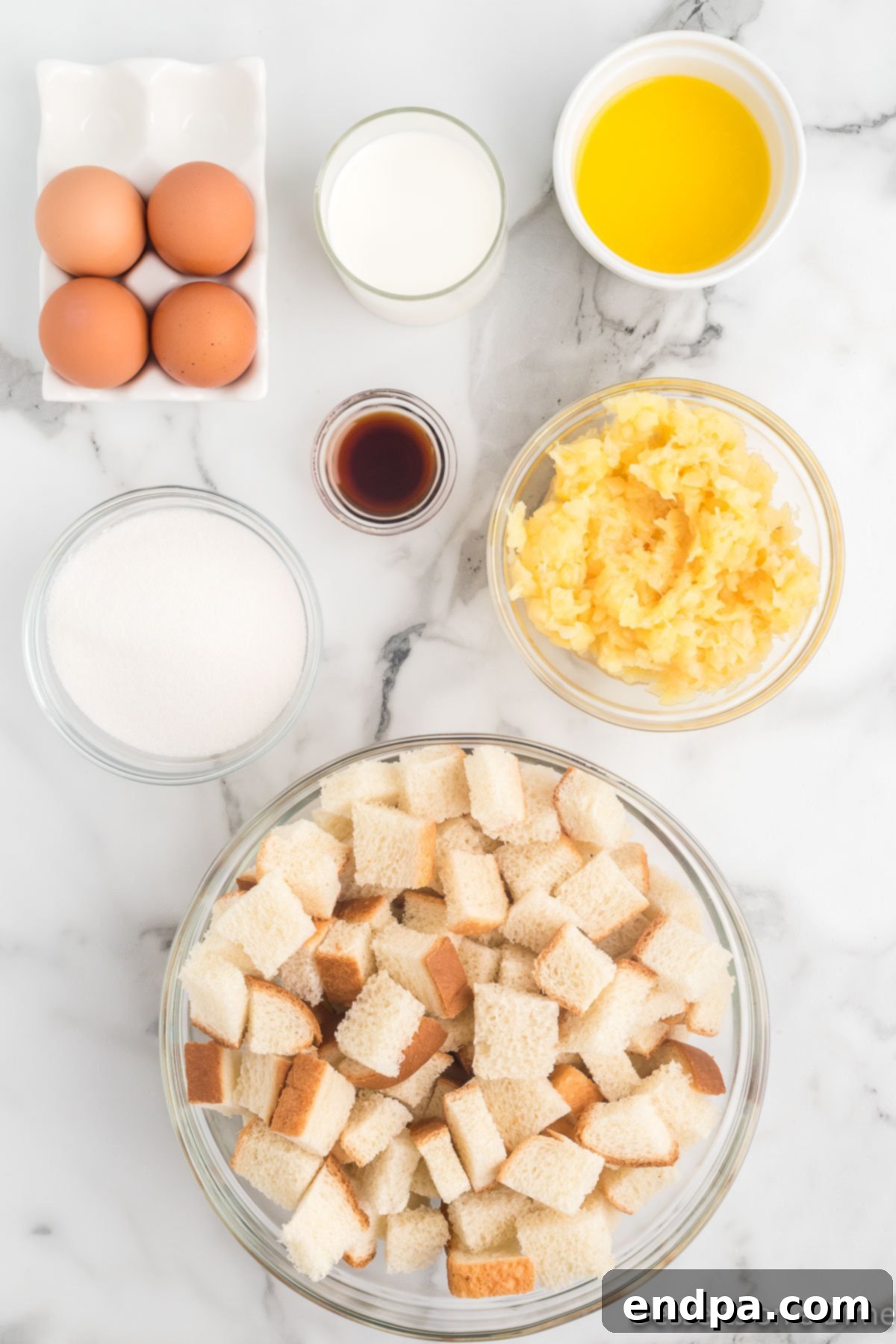 Tropical Pineapple Bread Pudding 3 Ingredients for recipe - butter, sugar, milk, eggs, pineapple, bread, vanilla, ice cream, caramel sauce.