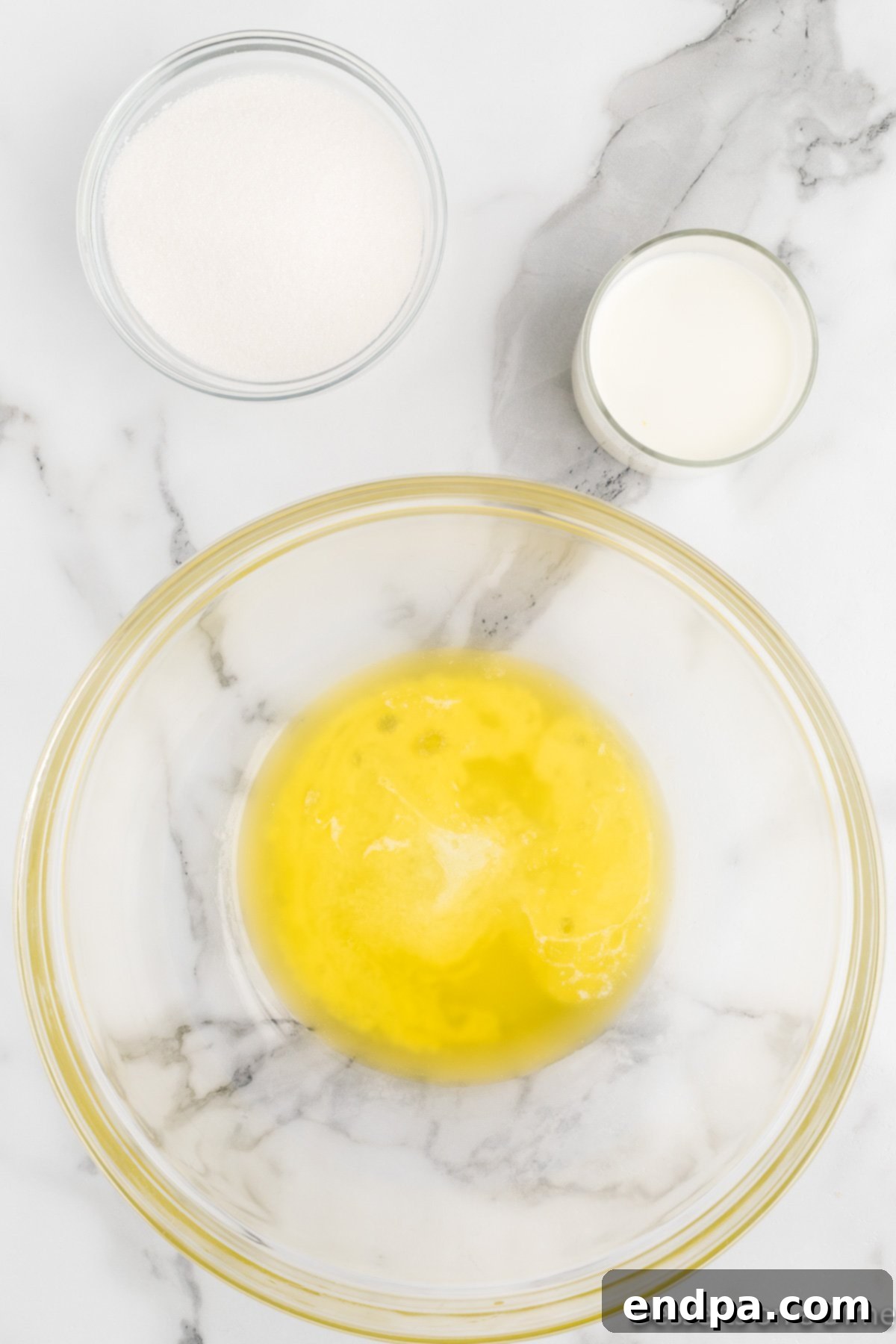 Tropical Pineapple Bread Pudding 4 Mixing bowl with melted butter.