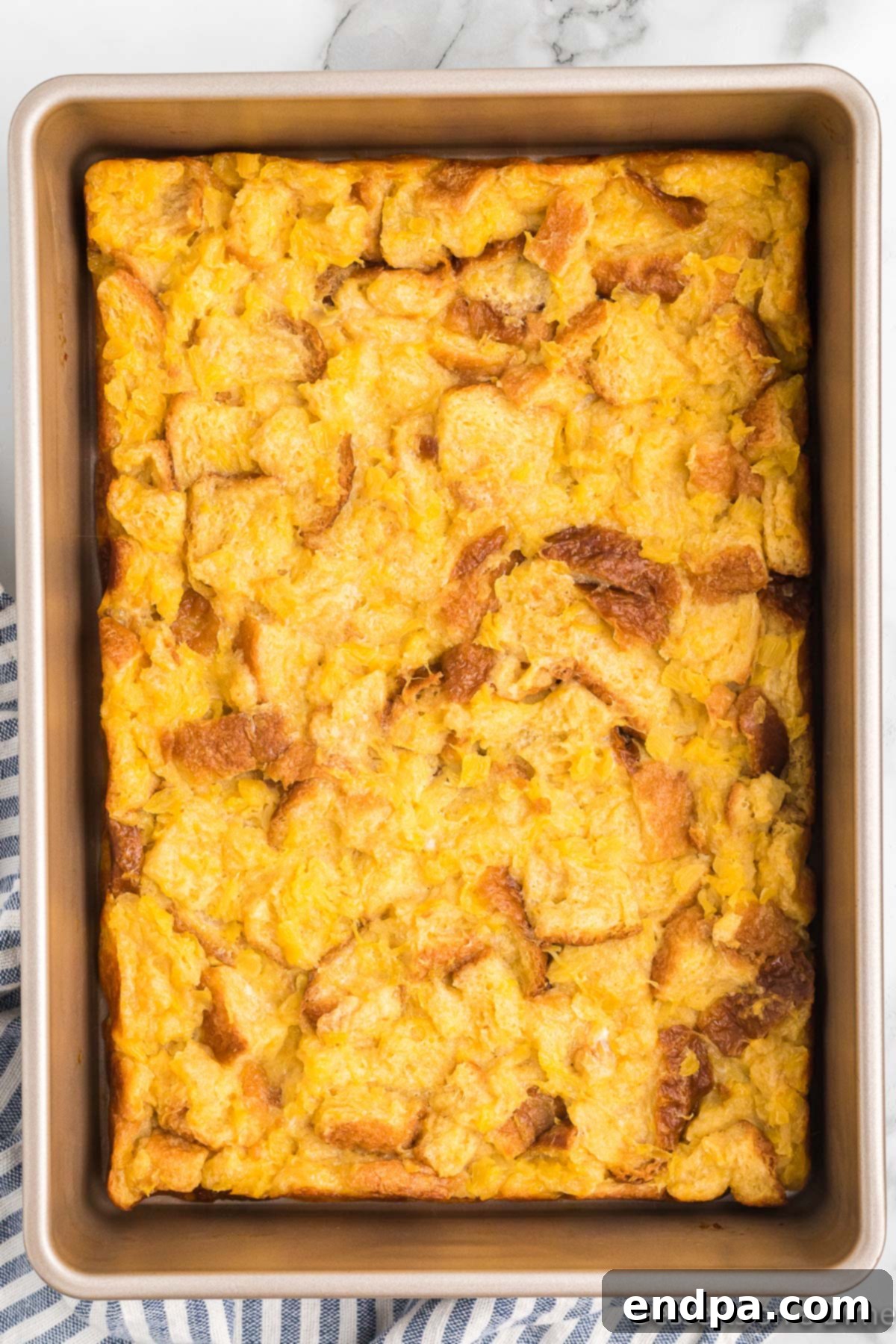 Tropical Pineapple Bread Pudding 8 Bread pudding baked and cooling in pan.
