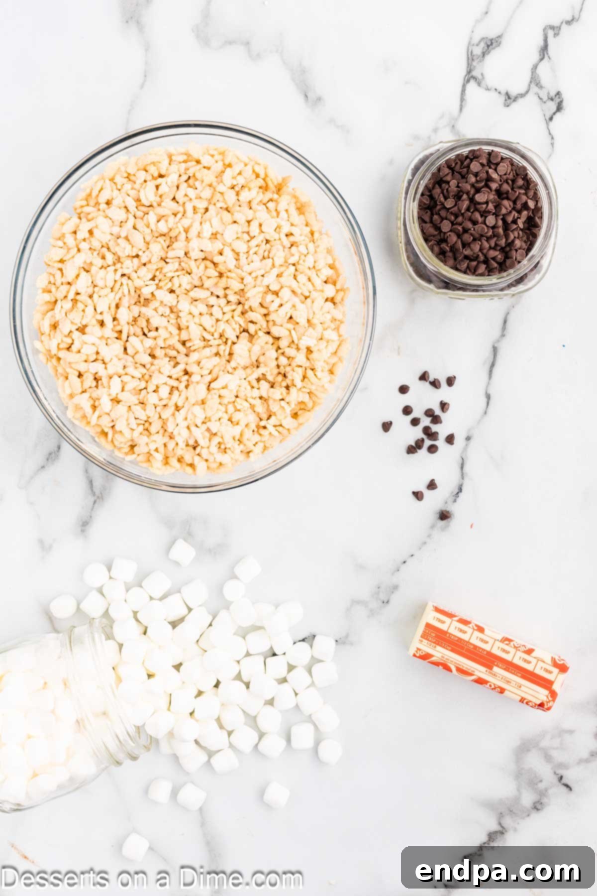 Ingredients for recipe - cereal, butter, marshmallows, chocolate chips. 