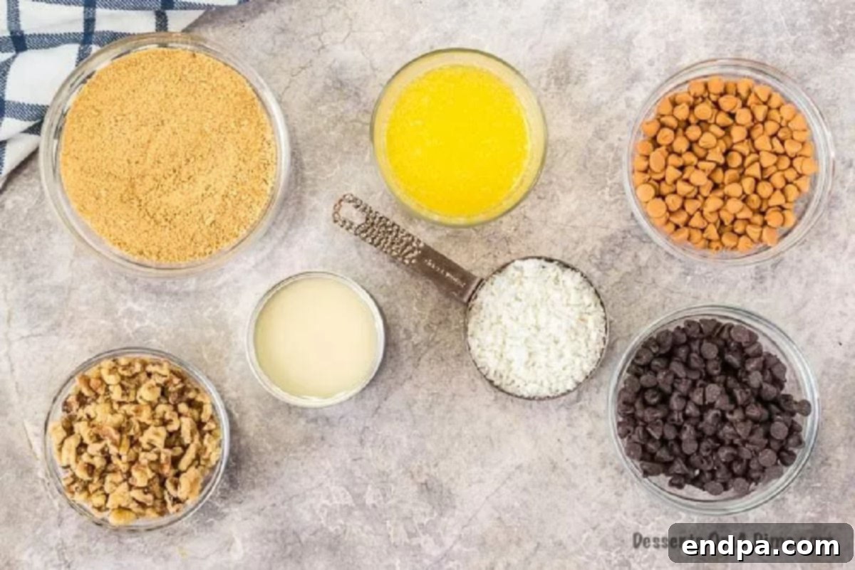 Enjoy decadent layers of chocolate chips, butterscotch, nuts and more in this Magic cookie bars recipe. Each bite is heavenly. Magic Cookie bar cookies are perfect for Christmas, 4th of July and more. Seven layer bars are easy and the best dessert with butterscotch. Everyone will love the 7 layer recipe. #dessertonadime #magiccookiebarsrecipe #eaglebrand #7layer Arrangement of Magic Bar ingredients: melted butter, chocolate chips, butterscotch chips, graham cracker crumbs, sweetened condensed milk, coconut, and walnuts