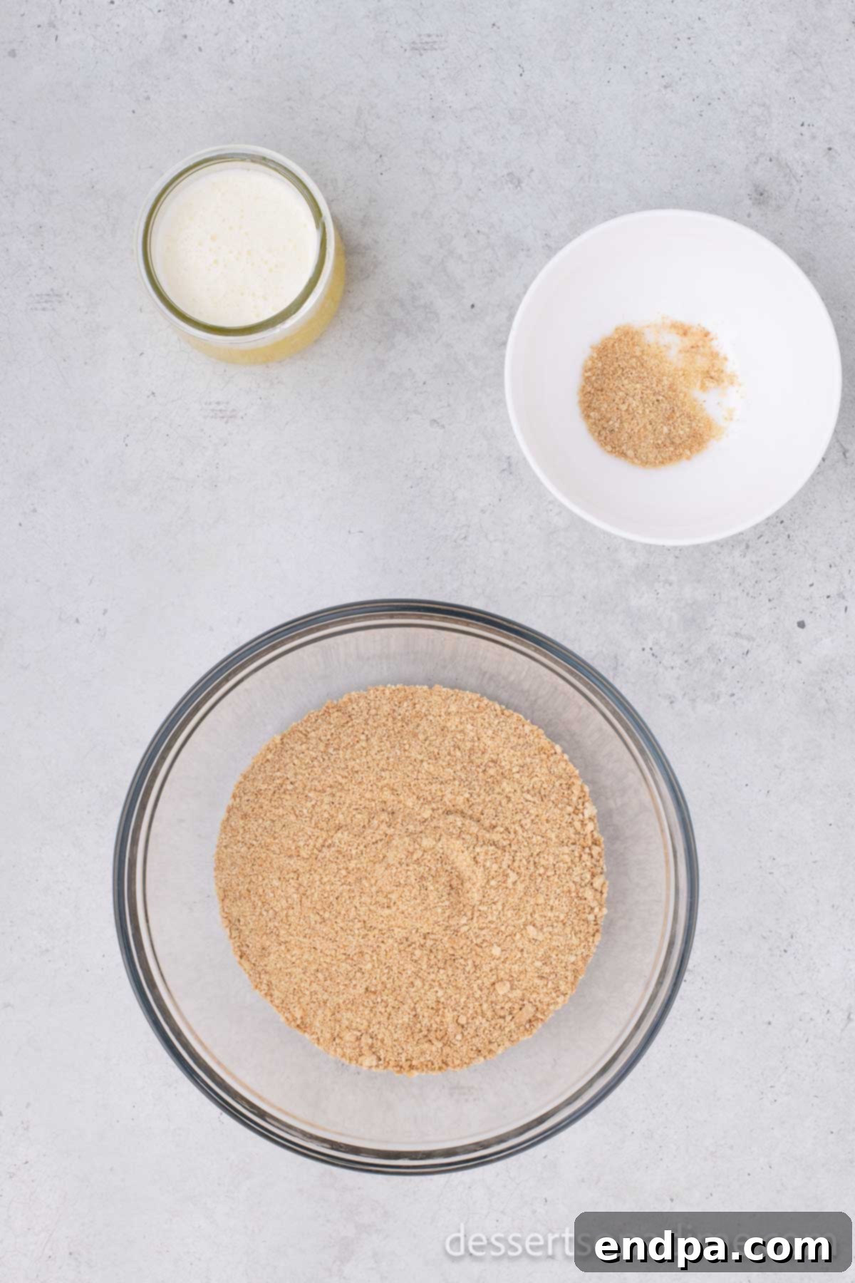 Irresistible Magic Cookie Bars Recipe 2 Graham cracker crumbs in a mixing bowl.