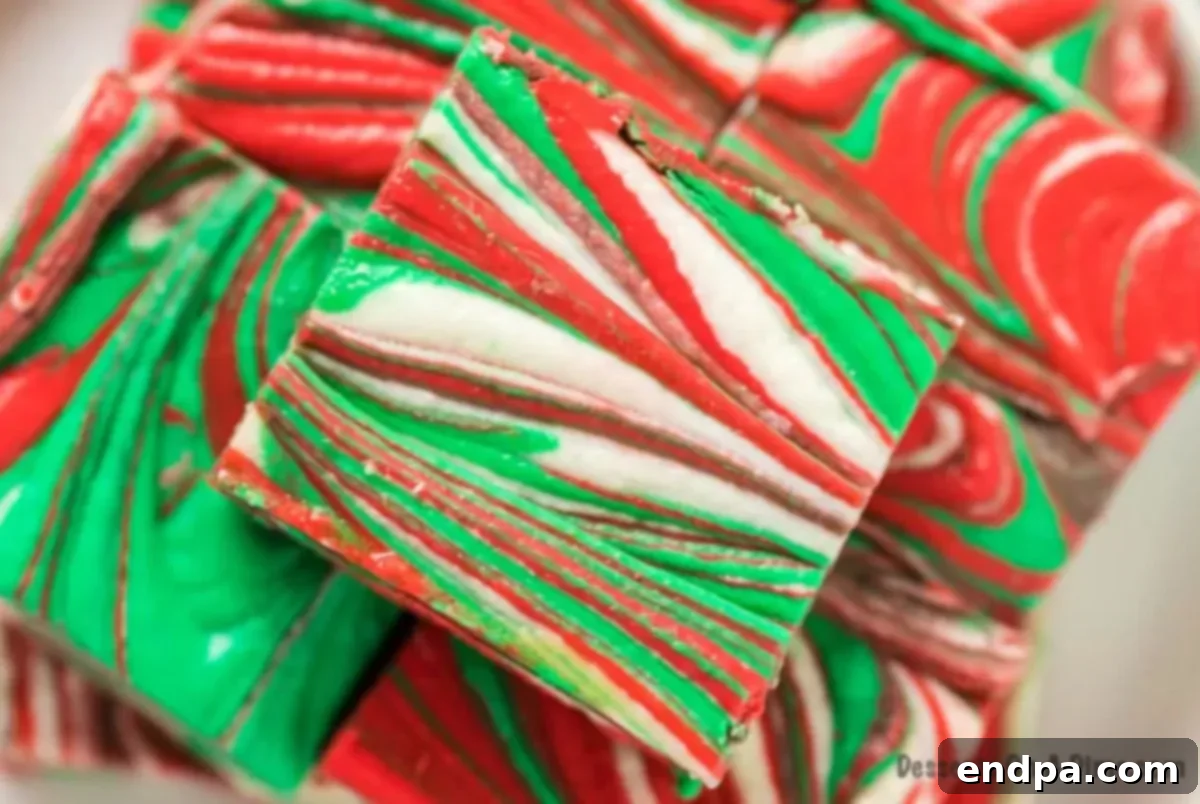 Festive Christmas fudge squares stacked invitingly, ready to be enjoyed.