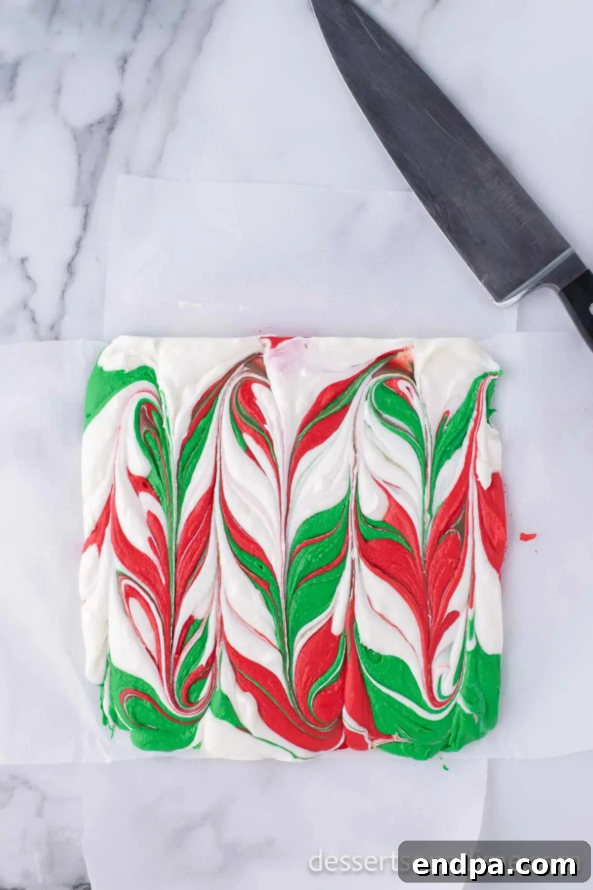 Set Christmas fudge removed from the pan, ready for slicing.