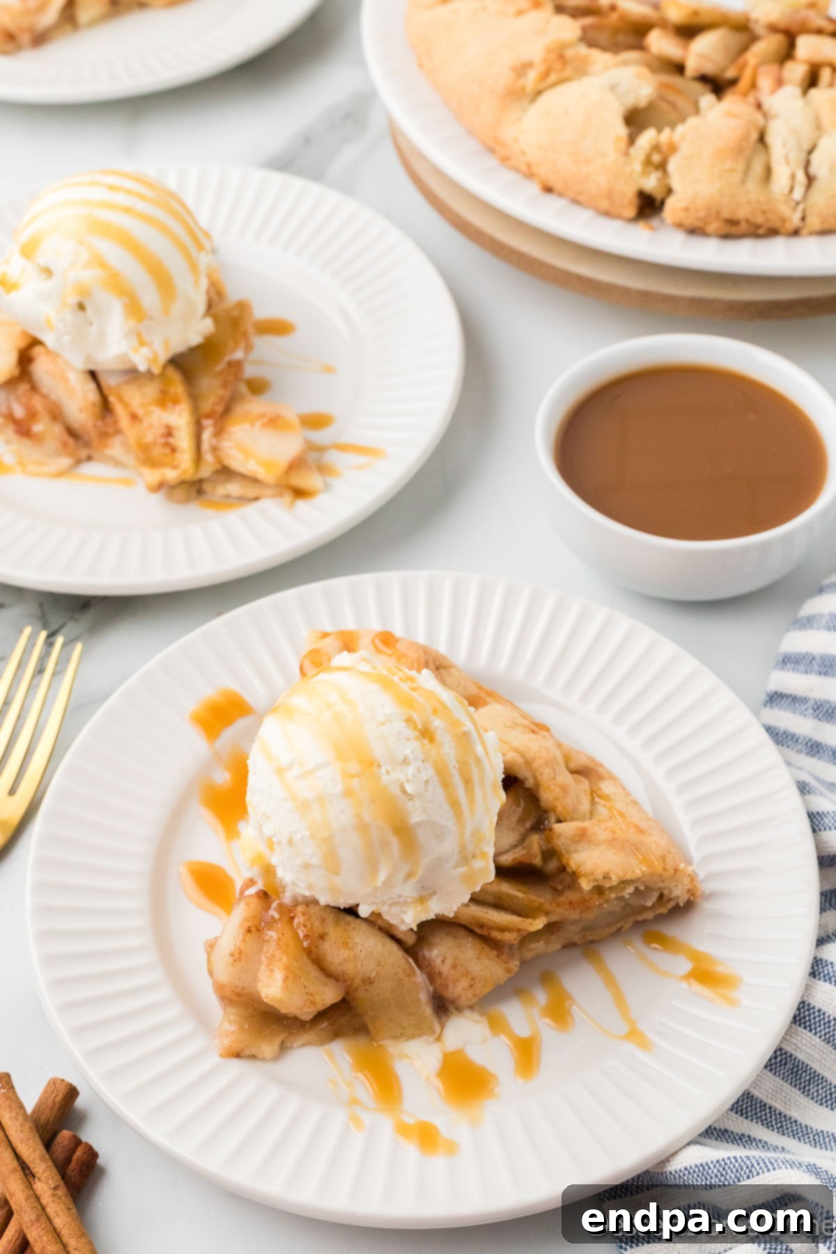 Apple Crostata on a plate topped with ice cream.