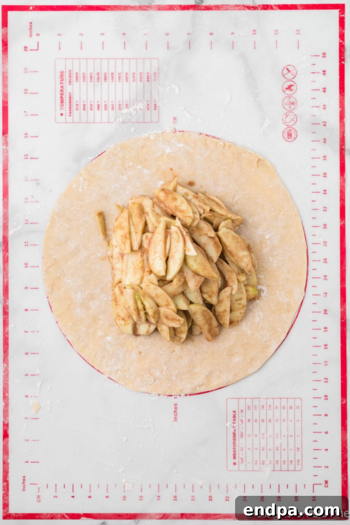 Apples on pie crust.