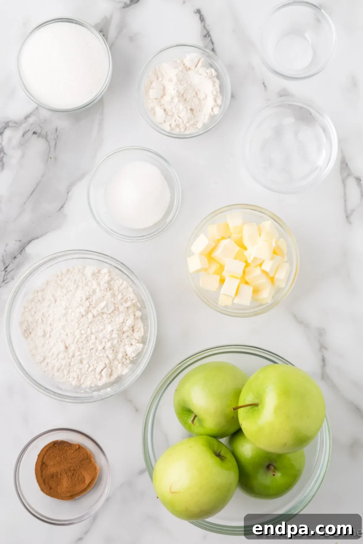 Ingredients for recipe - apples, butter, flour, spices, sugar.