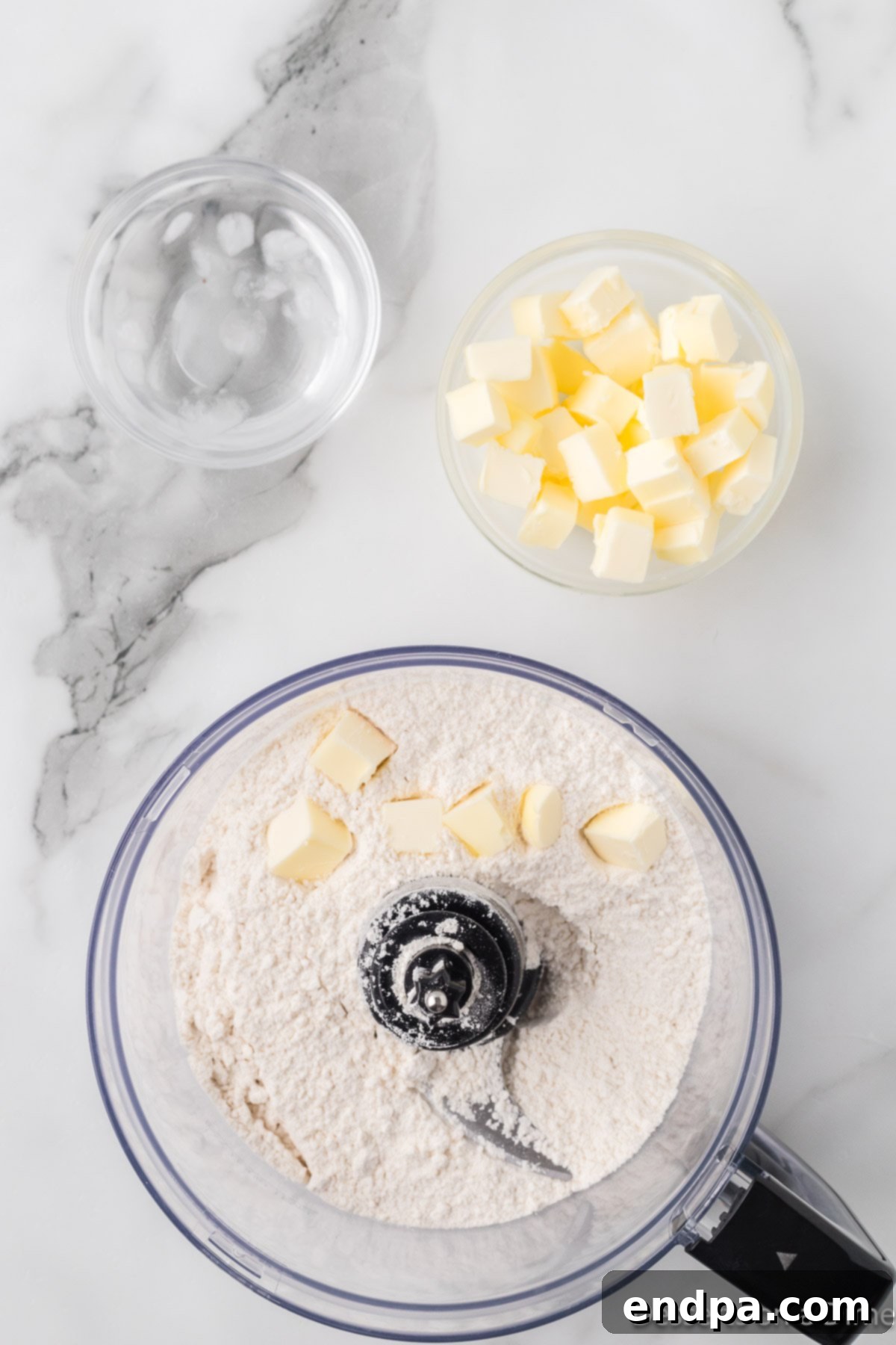 Butter cut into food processor.