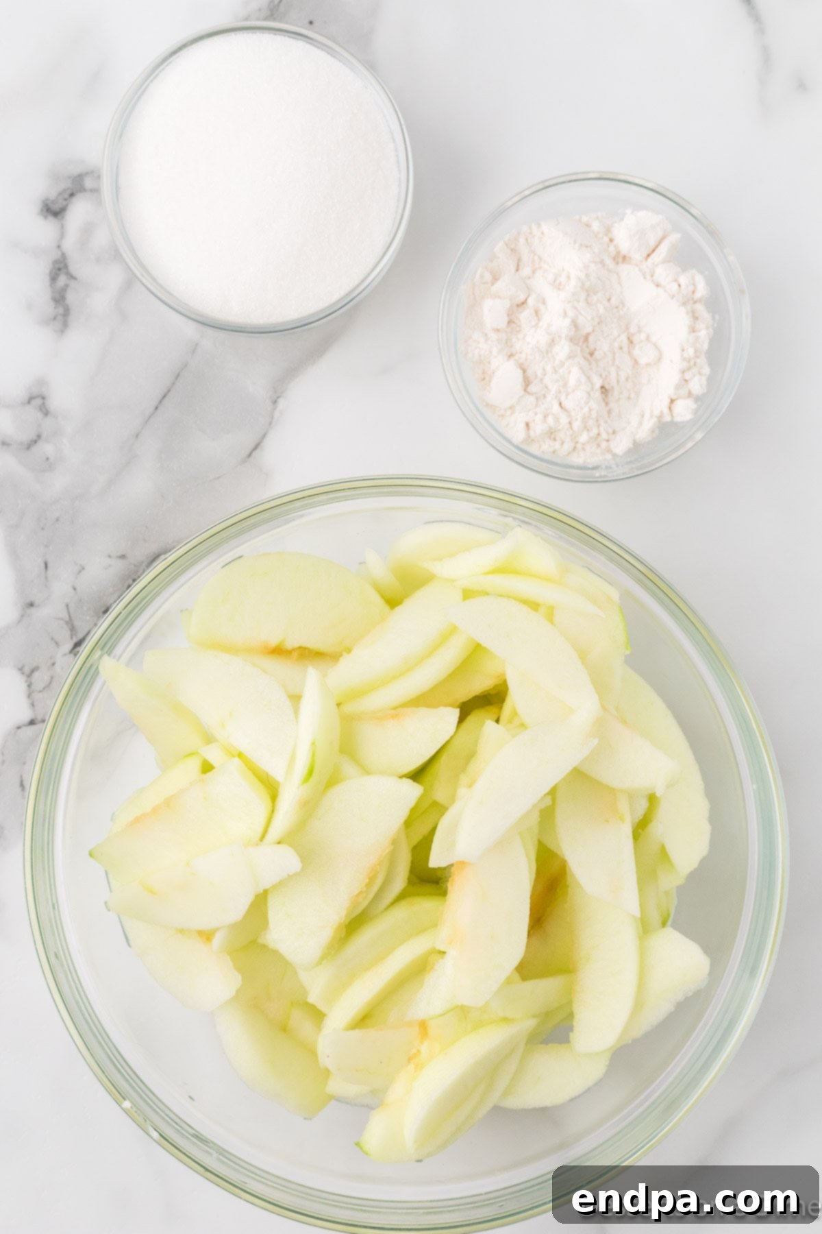 Apples in bowl sliced and ready.