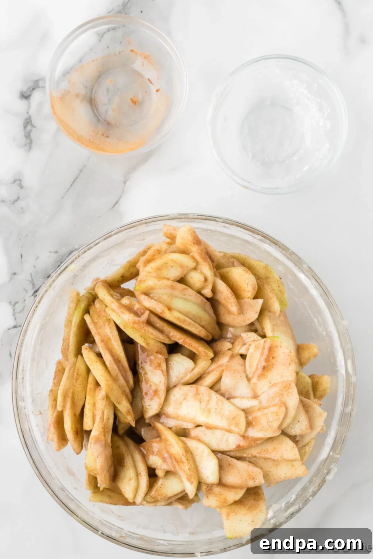 Apples in bowl with apple pie spice.