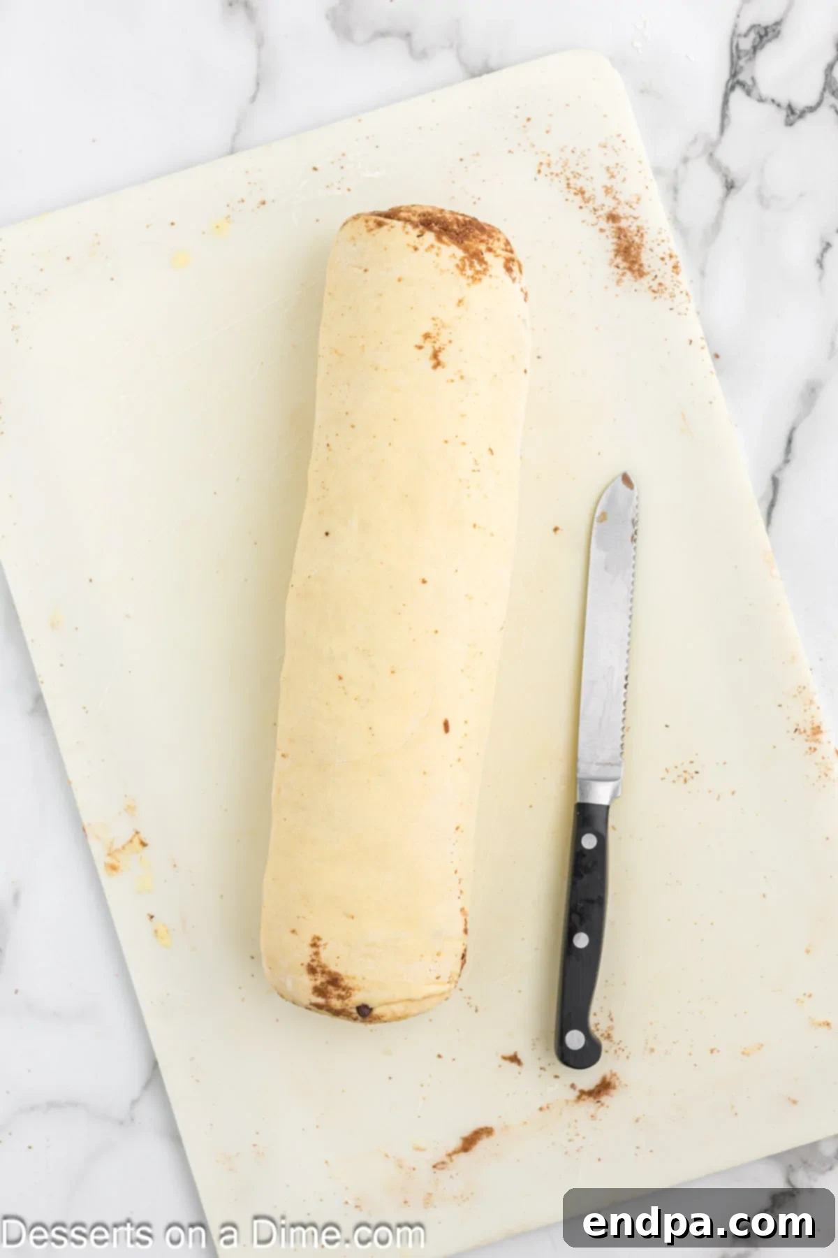 Dough tightly rolled into a coil after the filling has been applied.