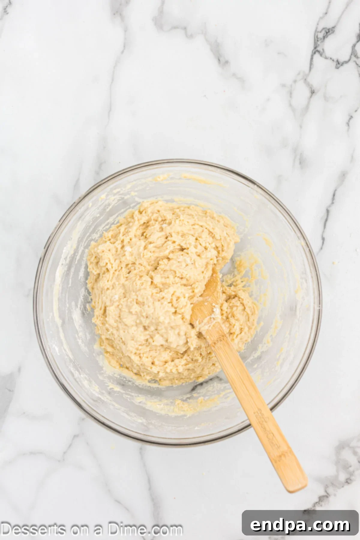 Melted butter and beaten eggs added to the yeast mixture and combined before pouring into dry ingredients.