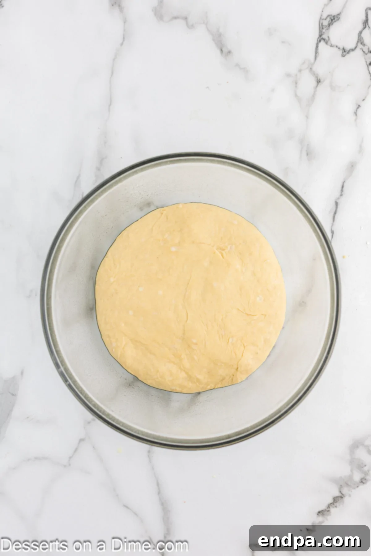Dough in a bowl after rising, having doubled in size.