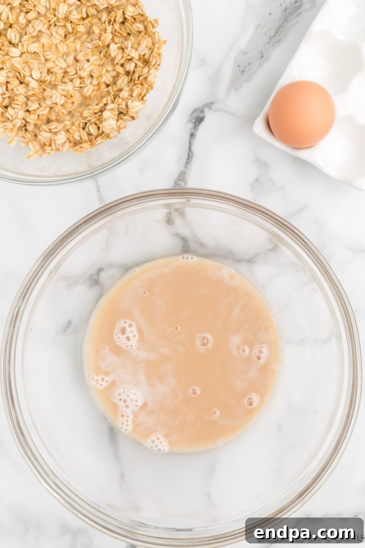 Foamy activated yeast in a bowl.