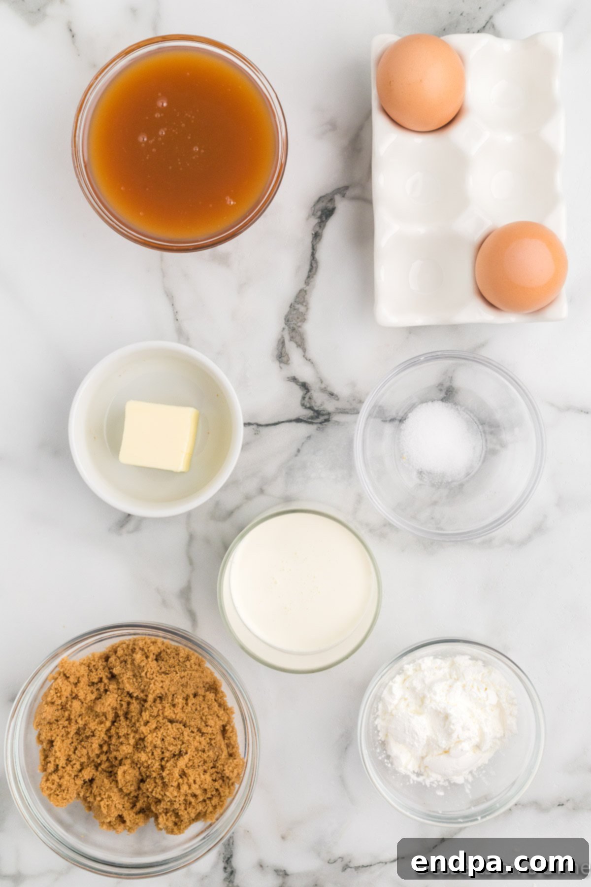 Ingredients for recipe - brown sugar, cornstarch, heavy cream, butter, eggs, caramel sauce.