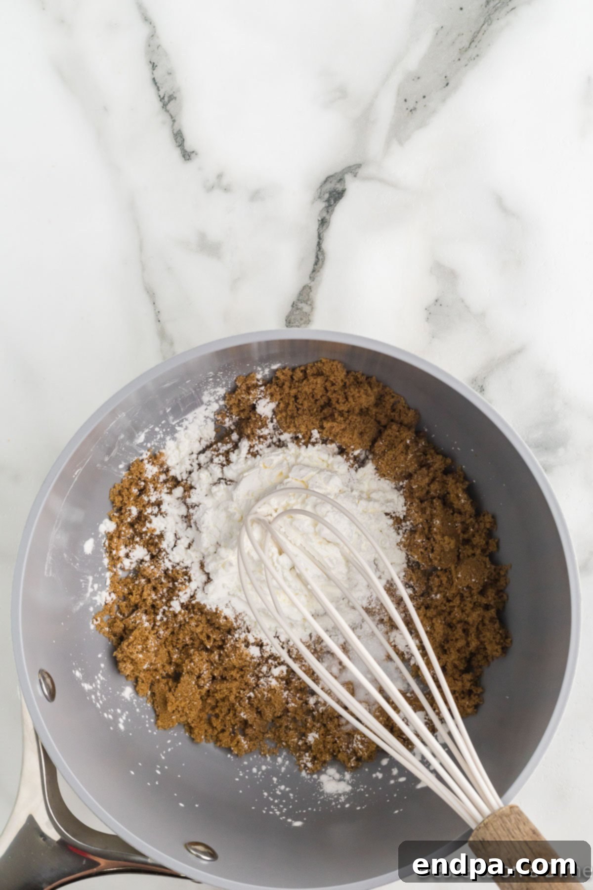 Saucepan with dry ingredients combined.