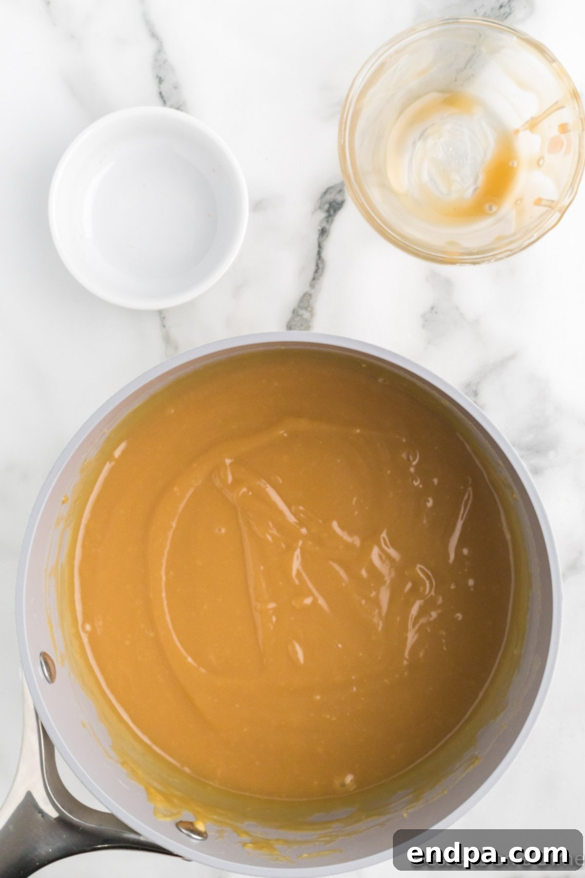 Eggs mixed with dry ingredients in saucepan.