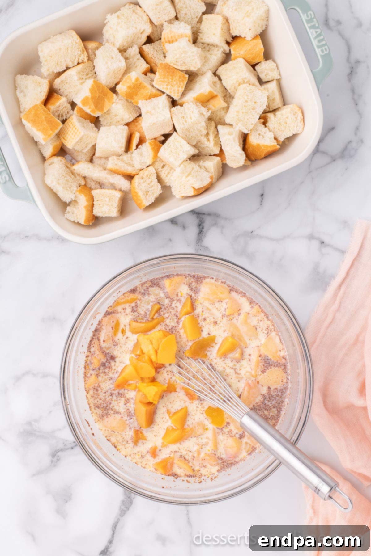 Summer Peach Bread Delight 7 Diced fresh peaches being stirred into the prepared custard mixture in a large bowl.