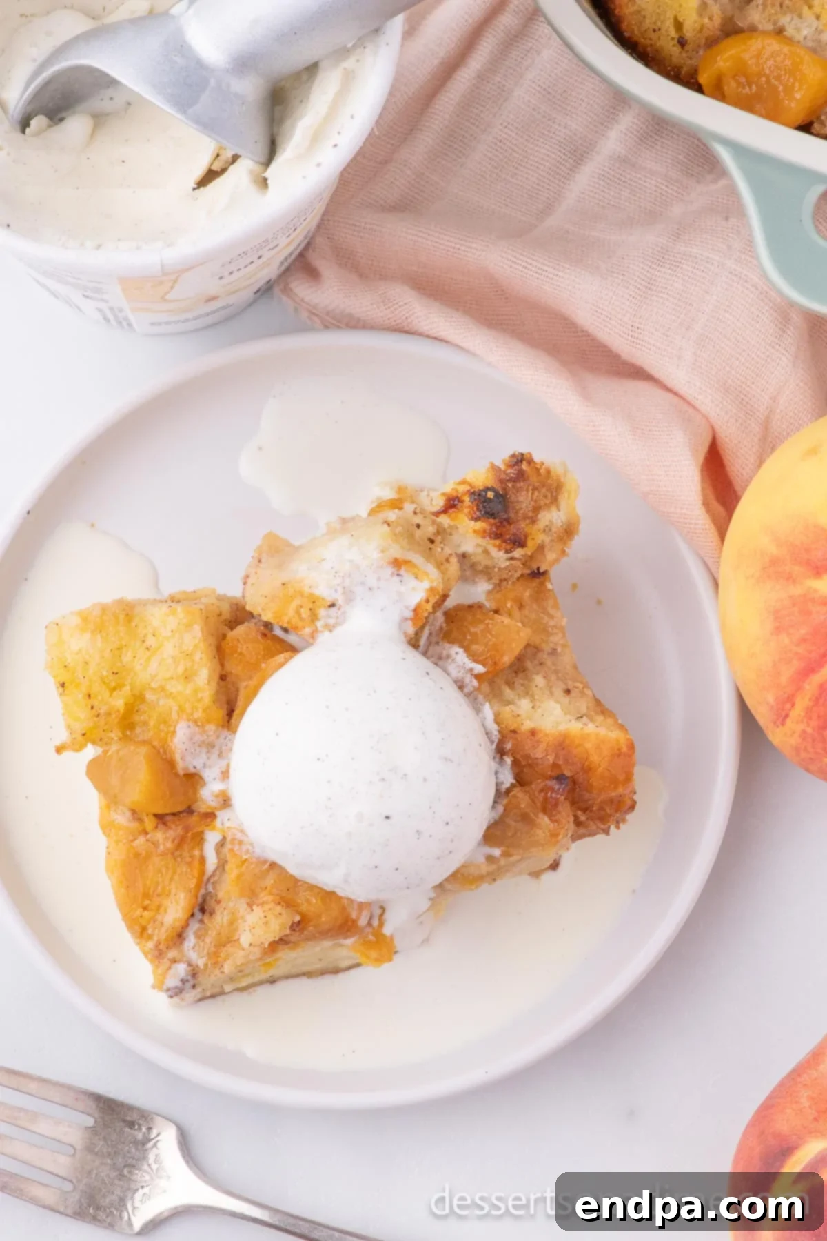 Summer Peach Bread Delight 10 Freshly baked peach bread pudding, still warm, topped with a scoop of melting peach ice cream and a swirl of caramel sauce.