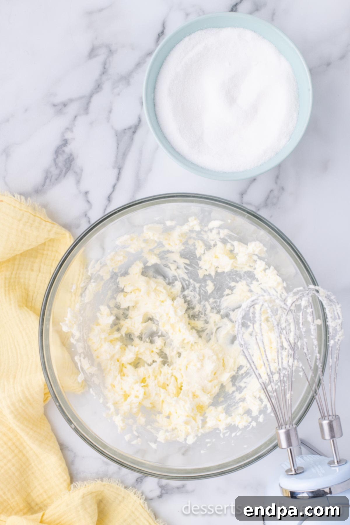 Luscious Lemon Blackberry Cake 4 A mixing bowl containing creamed butter and granulated sugar, light and fluffy.