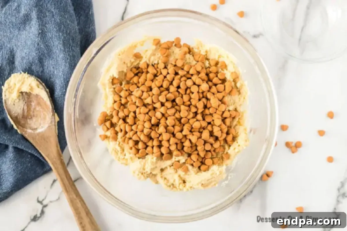 Chewy Butterscotch Cookies 3 Mixing in the butterscotch chips into the cookie batter mixture.