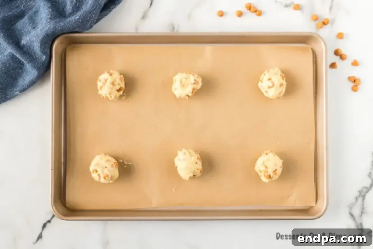 Chewy Butterscotch Cookies 4 Dropping cookie dough on the baking sheet for butterscotch cookies.