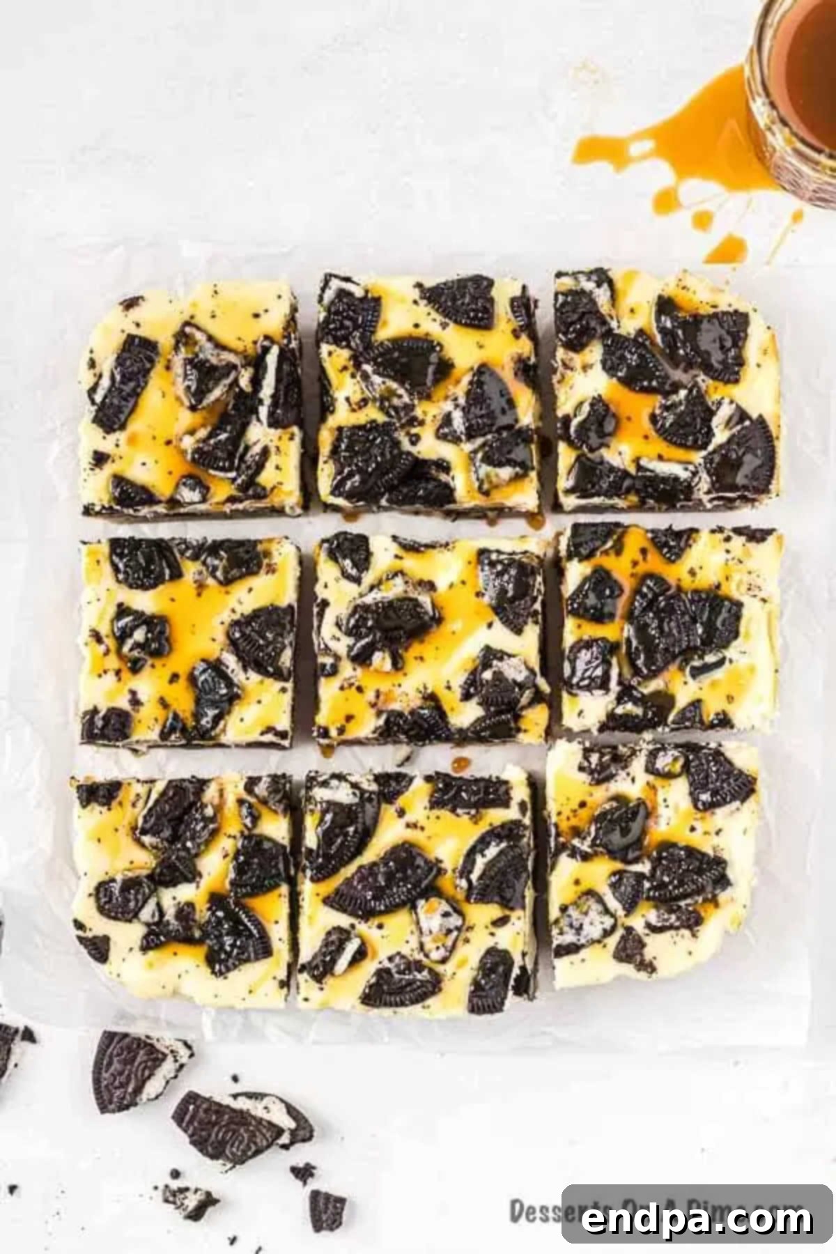 Ultimate Decadence Cheesecake Bars 10 Close-up of a square of Slutty Oreo Cheesecake, showing the distinct layers and rich texture.