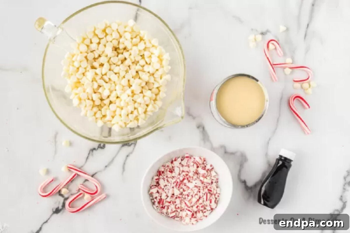 Ingredients for Peppermint Fudge: white chocolate chips, sweetened condensed milk, peppermint candy canes, and peppermint extract.