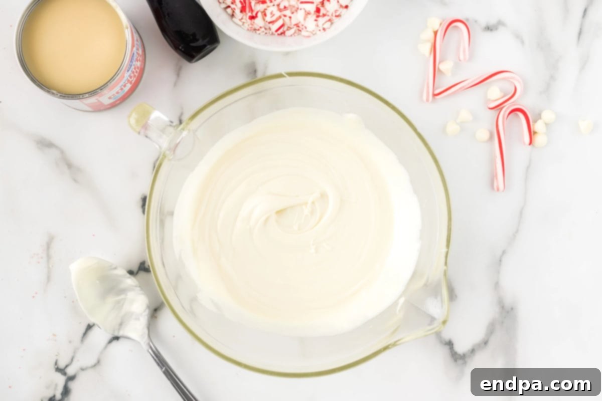 Melted white chocolate chips in a microwave-safe bowl.