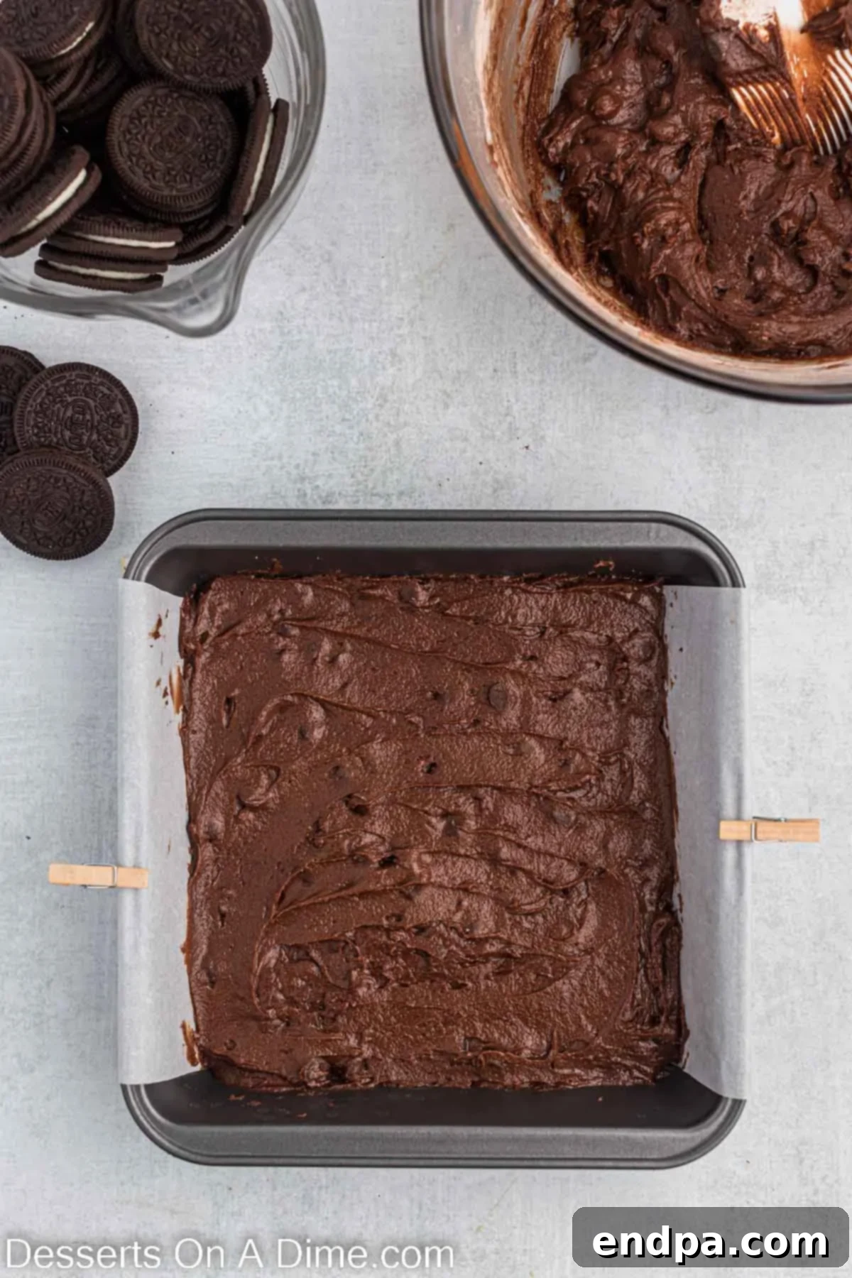 Half of the brownie batter poured into the prepared baking dish.
