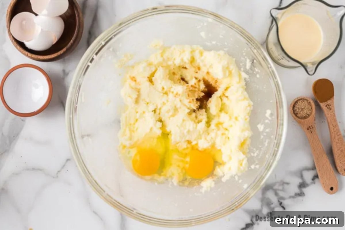 Eggs and vanilla extract added to the butter and sugar mixture.
