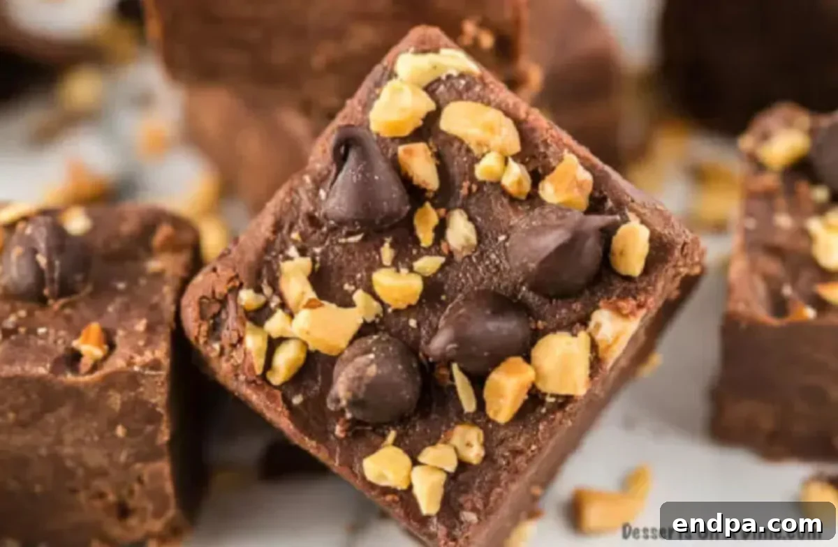 Close-up of creamy chocolate peanut butter fudge squares, showcasing their rich texture and perfect layers, ready to be enjoyed.