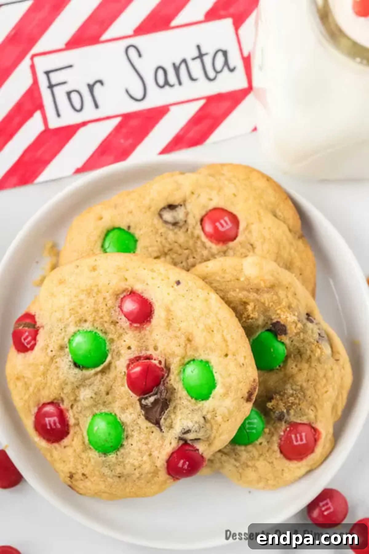 Easy Santa Cookies Recipe: The Best Chocolate Chip and M&M Christmas Cookies for Santa's Plate Stacked Santa Cookies bursting with chocolate chips and M&Ms, ready for Christmas