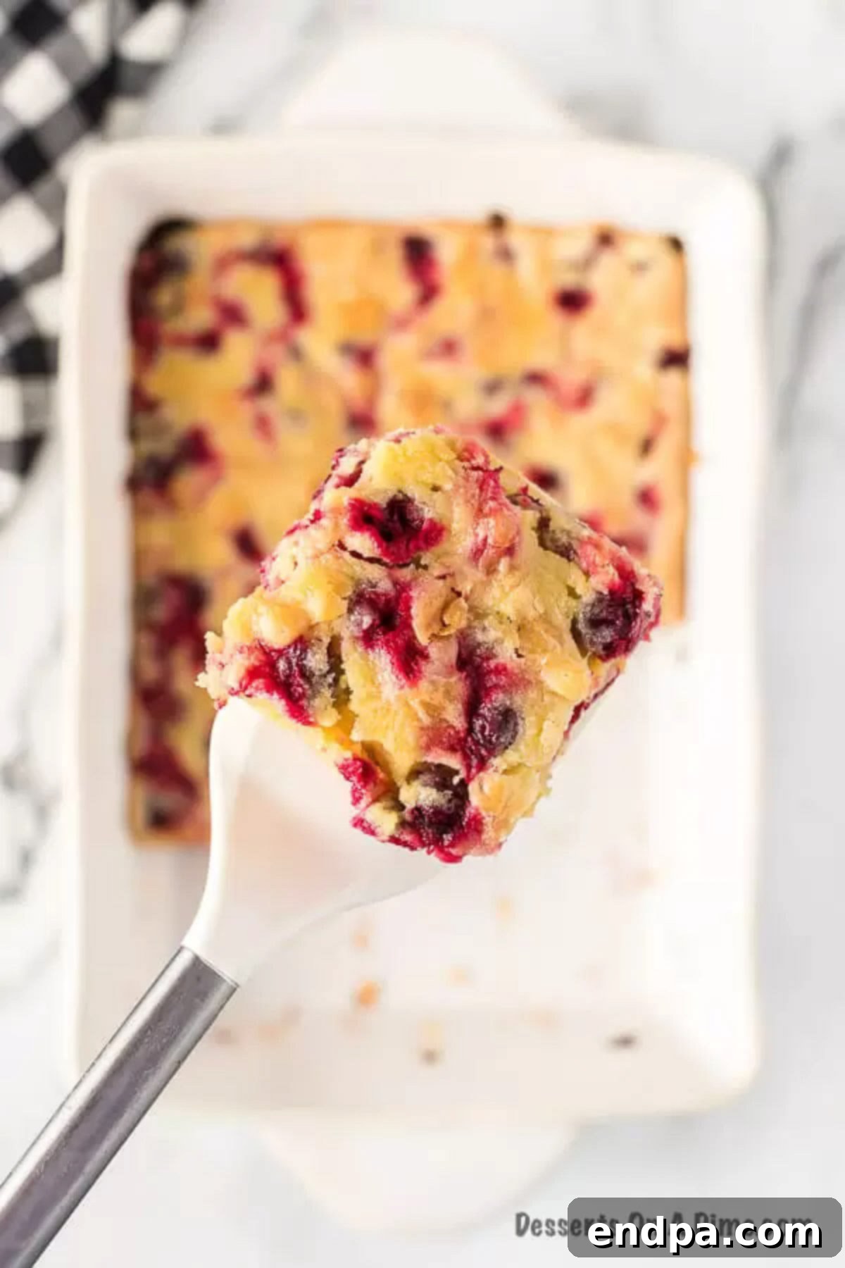 Serving of Cranberry Cake on a spatula