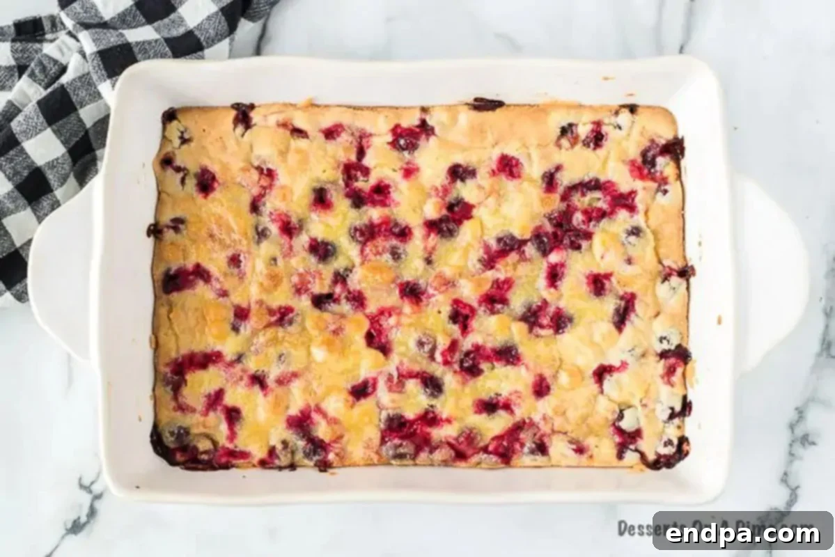 Cranberry cake baking until golden brown.