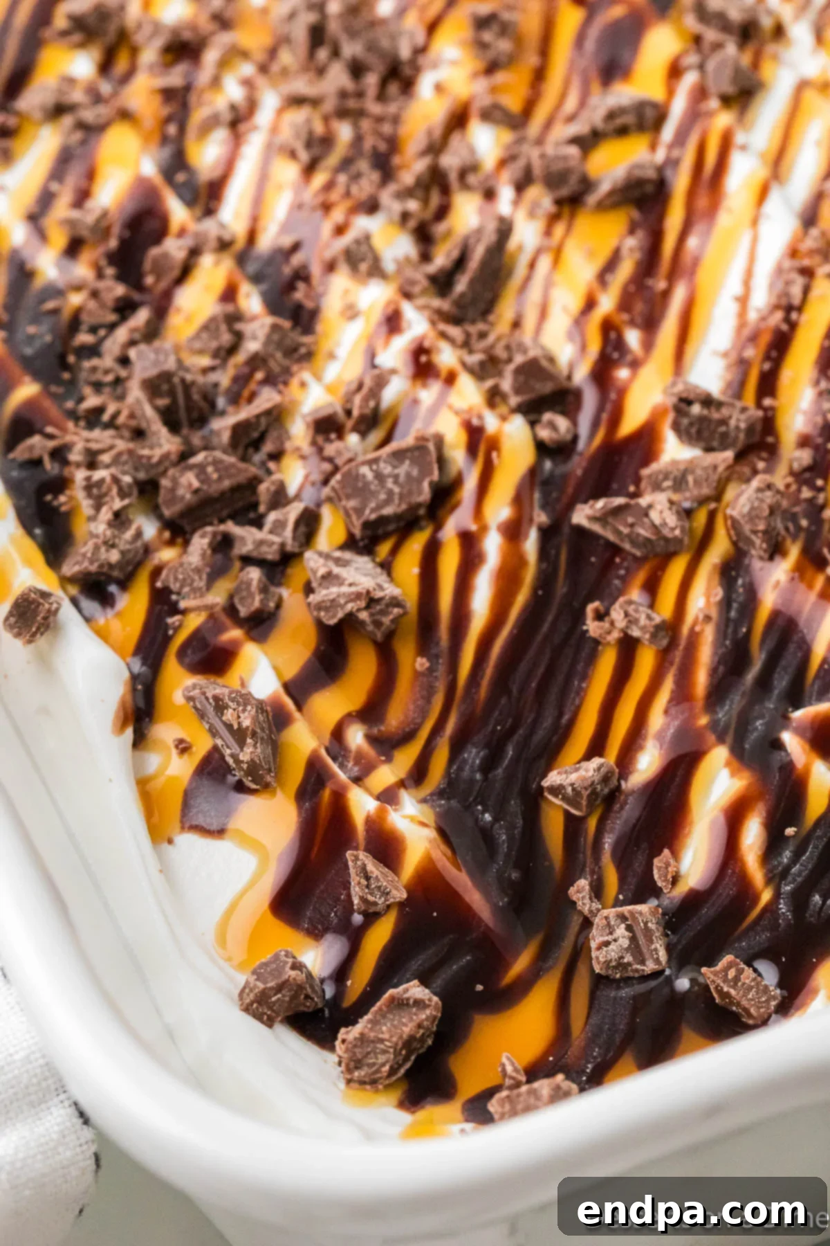 Gooey Chocolate Caramel Poke Cake 10 Cake in dish ready to serve.