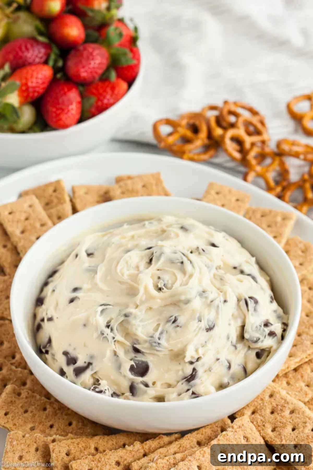 A beautifully presented bowl of Chocolate Chip Cookie Dough Dip, rich with chocolate chips, ready to be served.