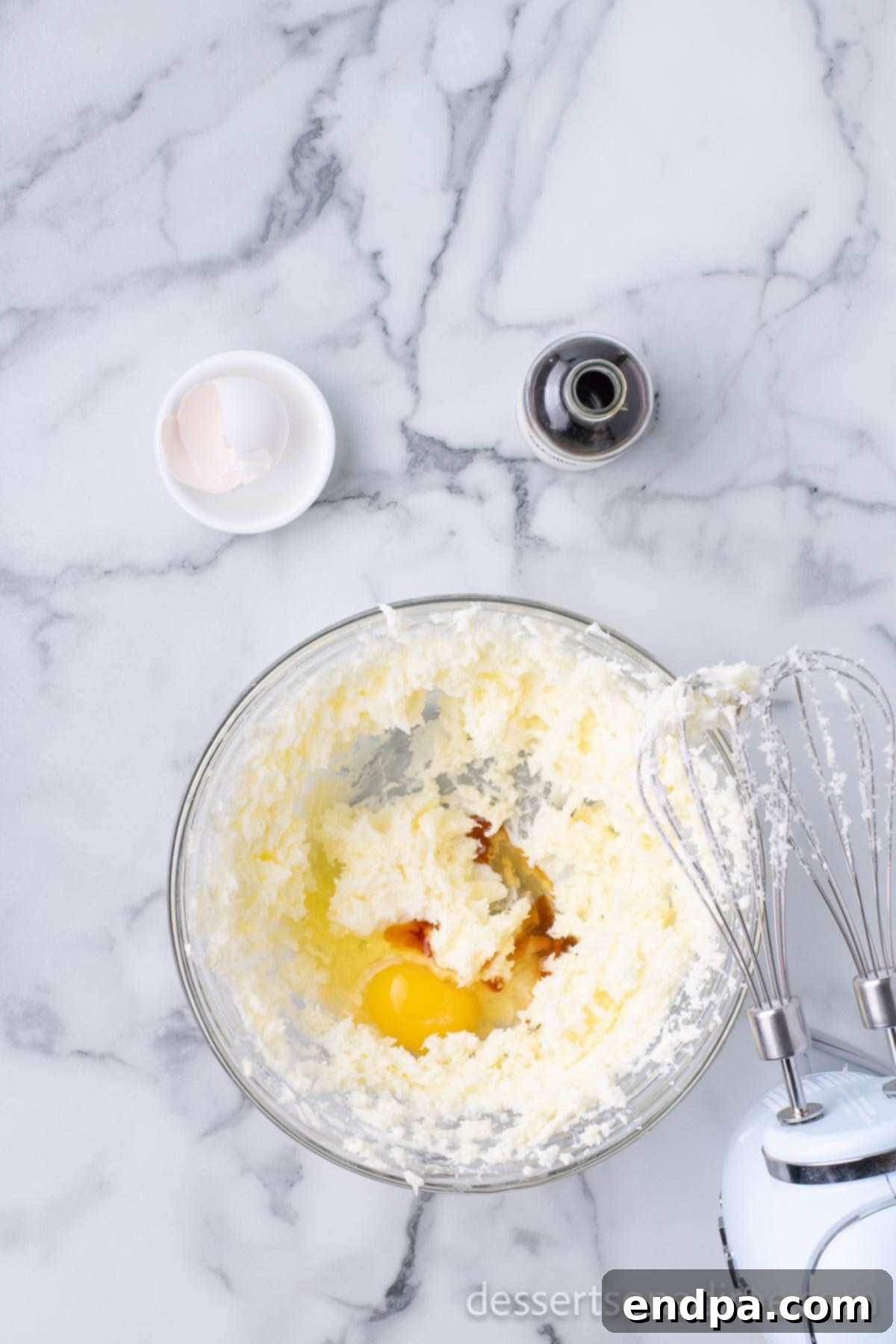 Dark Chocolate-Dipped Peppermint Cookie Delights 4 Egg and vanilla extract added to the creamed butter and sugar mixture.