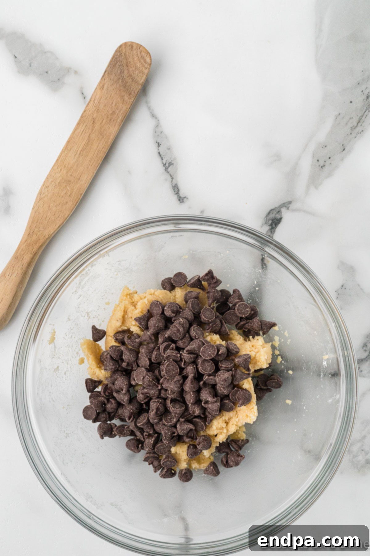 Keto Cookie Dough Bliss 6 Sugar-free chocolate chips are gently folded into the prepared keto edible cookie dough.