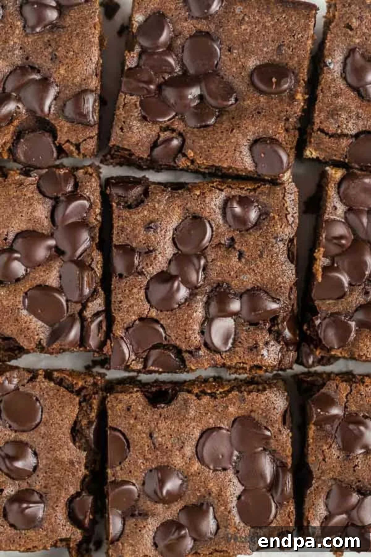 Delicious Keto Brownies: An easy low-carb, fudgy treat made with almond flour and cocoa powder. Fudgy Keto Brownies cut into perfect squares, ready to be enjoyed.