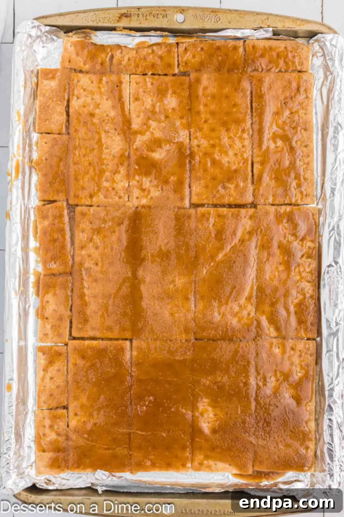 Brown sugar mixture spread on top of graham crackers.