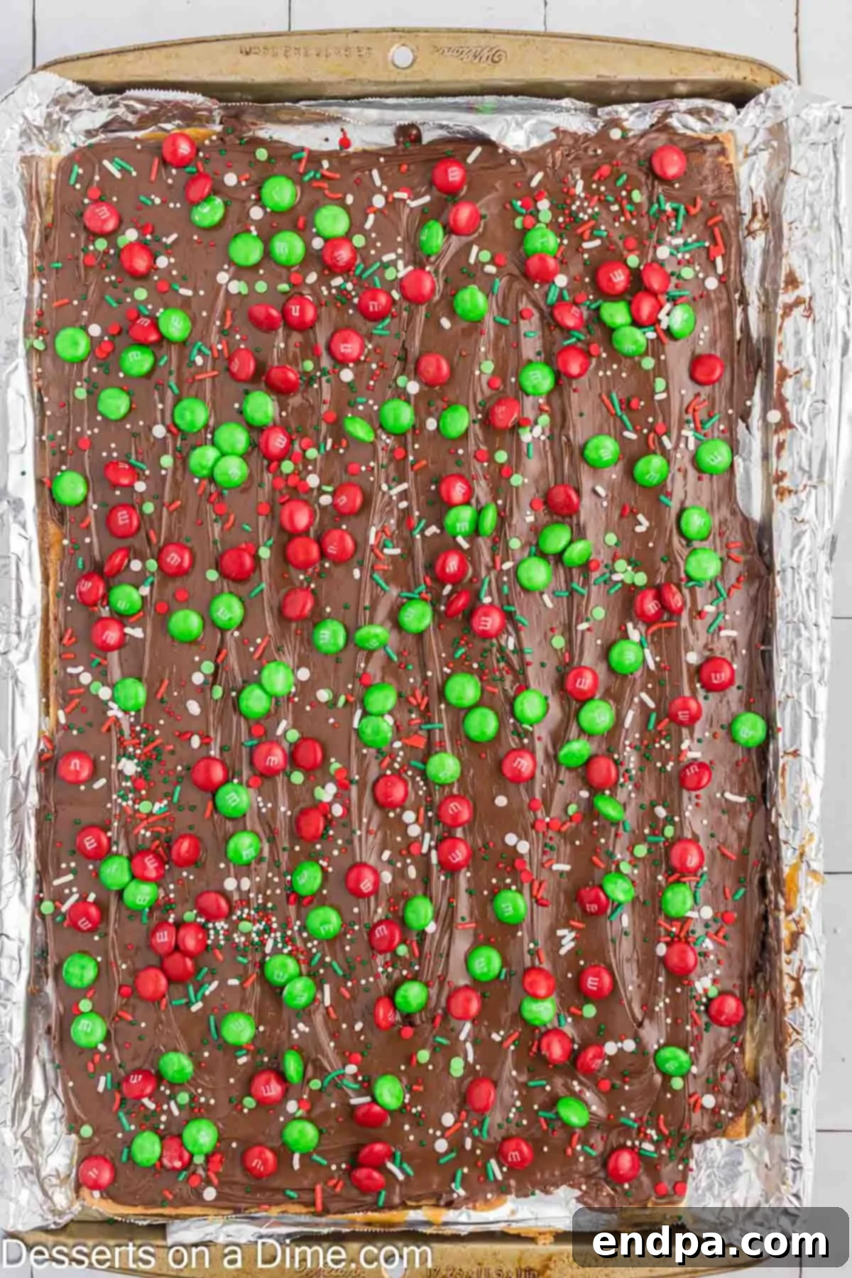 Candy and sprinkles on top of bark.