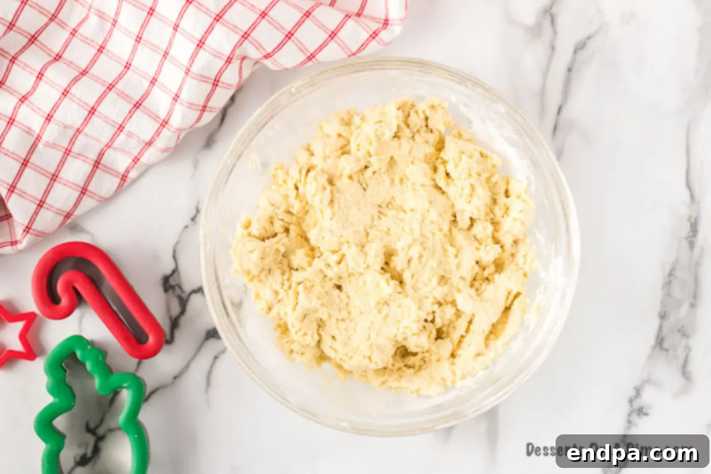 Smooth cookie dough in a mixing bowl, ready for the next step.