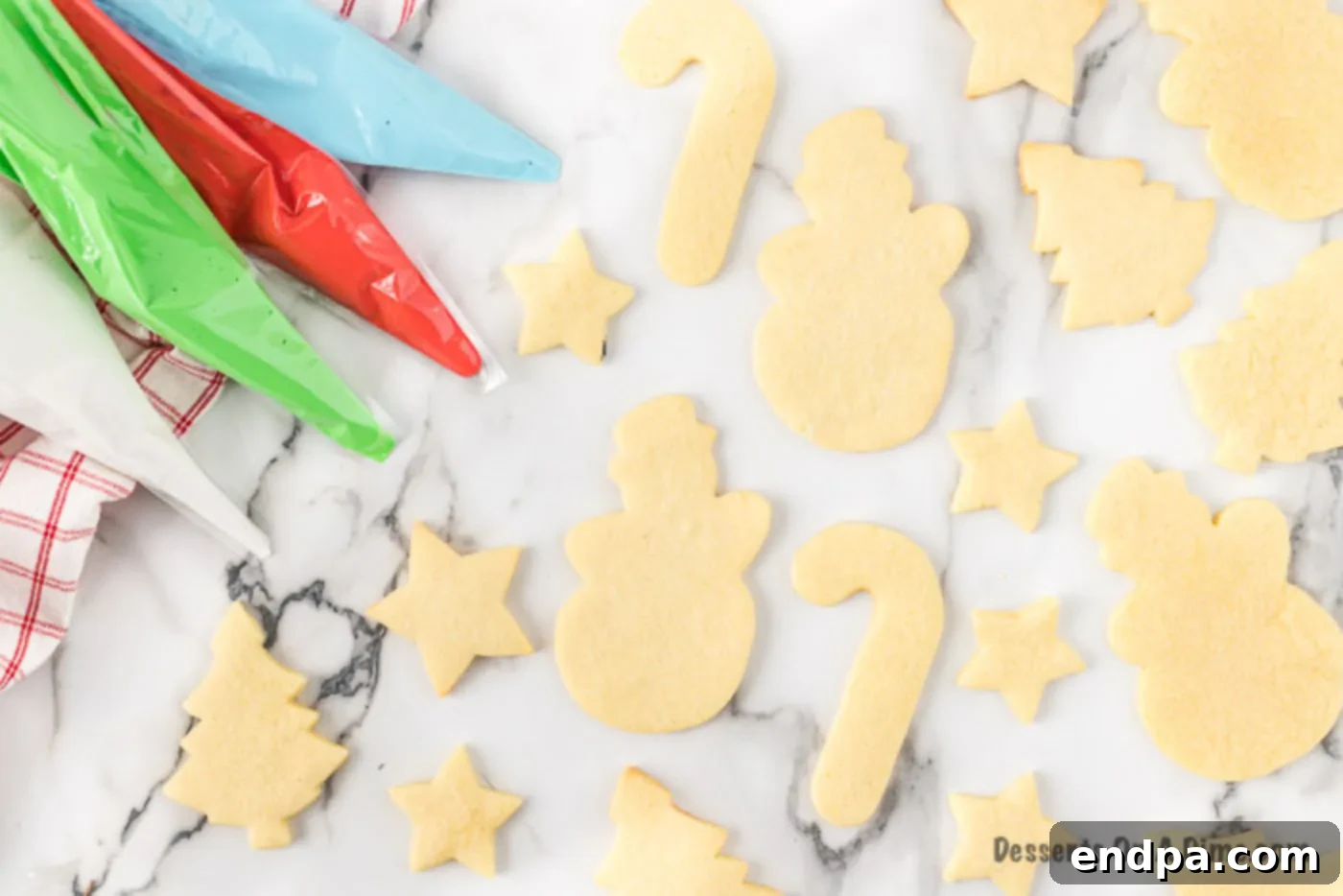 Piping bags filled with various colors of royal icing, ready for cookie decoration.
