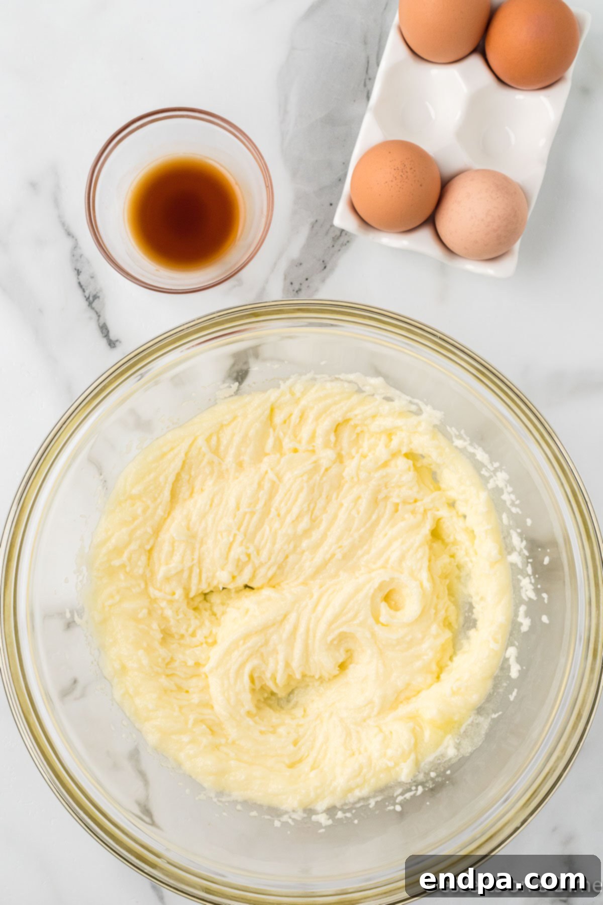 Sweetheart Brownies 4 Bowl with melted butter and granulated sugar, ready to be mixed.