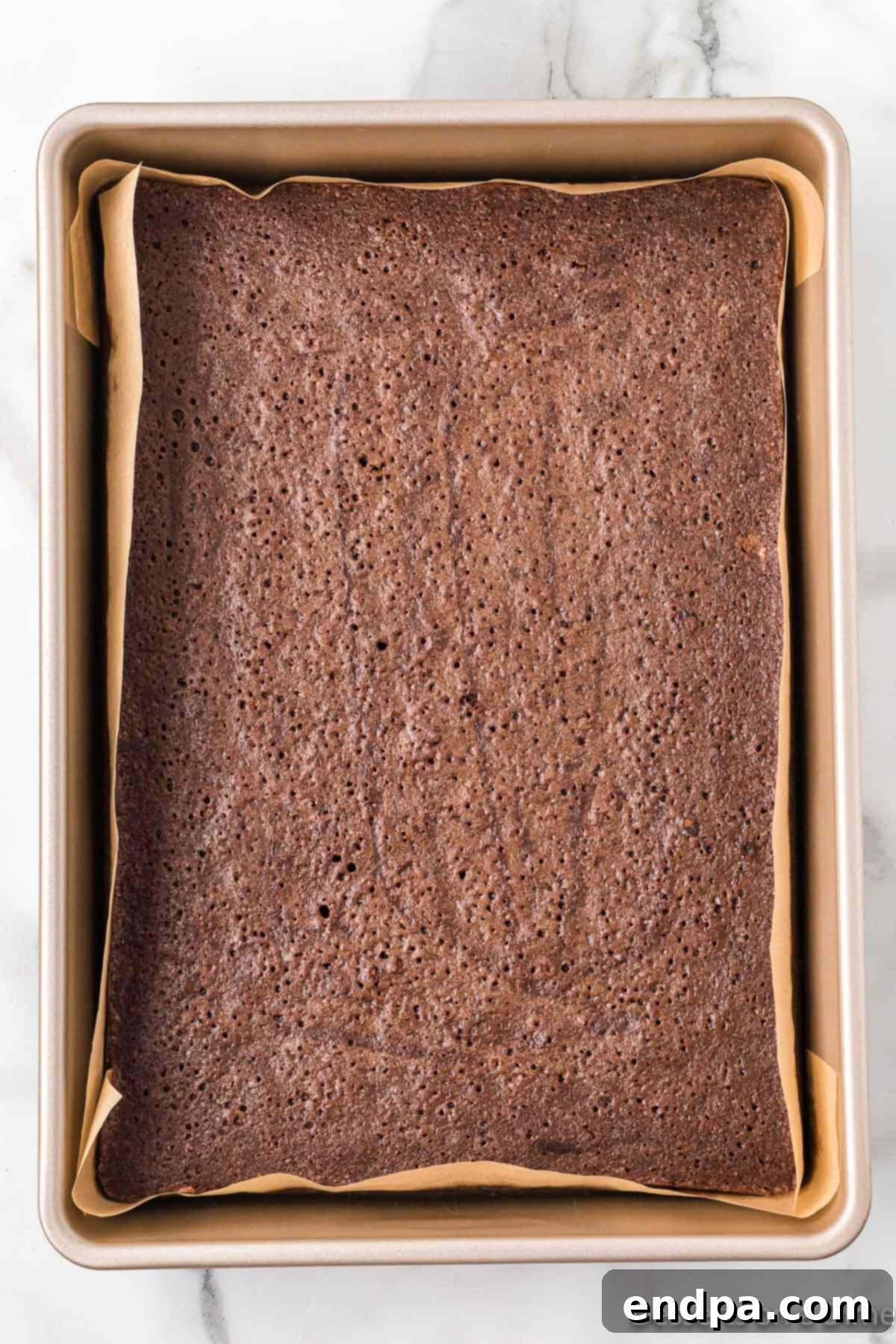 Sweetheart Brownies 7 Baked brownies in the pan, golden brown and ready to cool.