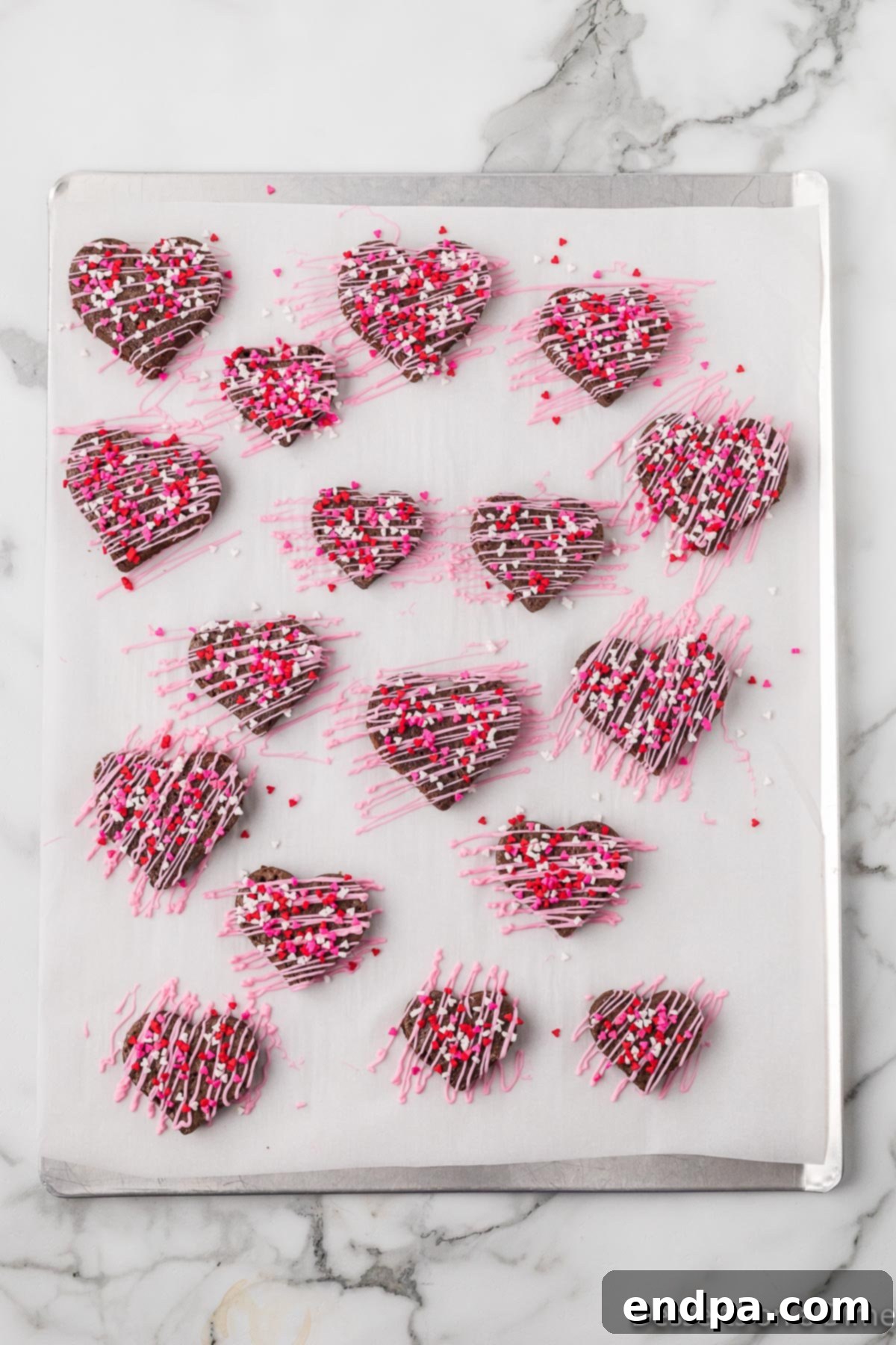 Sweetheart Brownies 9 Heart-shaped brownies drizzled with pink candy melts and topped with colorful sprinkles.