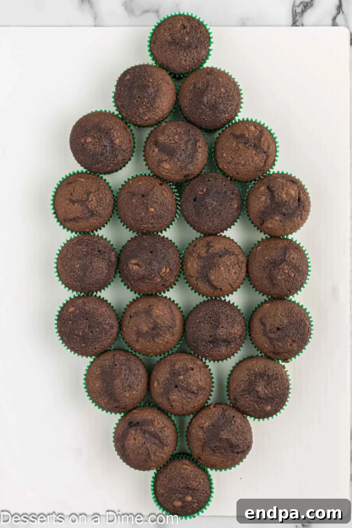 Chocolate cupcakes arranged into a football. 